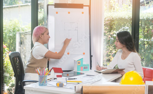 Architect woman engineer design working on blueprint planning concept, working with new startup project in modern