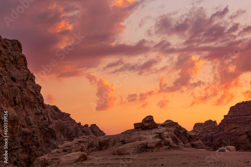 Sunset colorful orange sky landscape with sandstone rocks in Little Petra archaeological site, Jordan