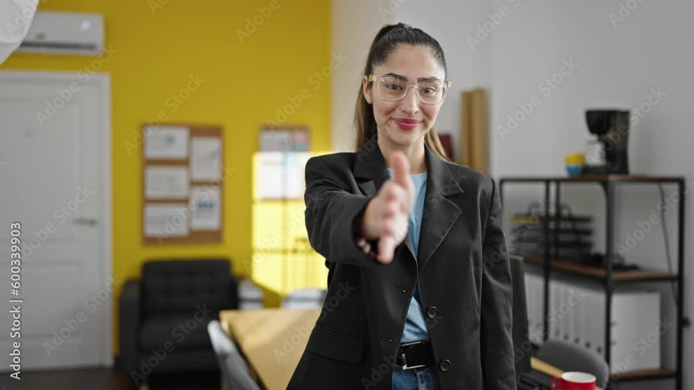 Young beautiful hispanic woman business worker smiling confident shake hand at office Young beautiful hispanic woman business worker smiling confident shake hand at office