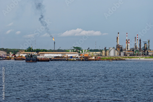 The Petrochemical Complex at Pointe Clairette in the Oil Port of Port Gentil with various Vessels awaiting loading and unloading on the small Quays.