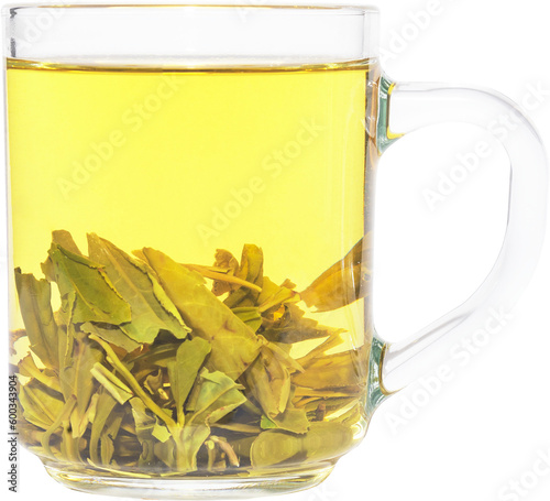 Tea brewing in transparent glass cup. Dragon Well green tea (Longjing tea).
