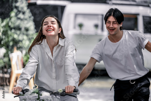 The soon-to-be life partners ride their bikes together. A young adult couple's romantic love, caring, and devotion. Long association and mutual understanding enhance the growth of a close relationship