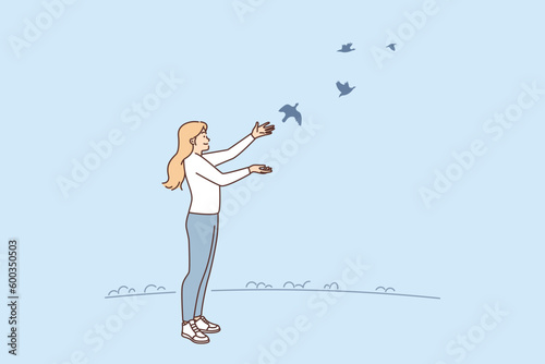 Woman releases pigeons birds to freedom for concept hope and faith in happy future