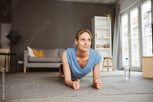 Young blonde woman practicing yoga in her apartment © contrastwerkstatt