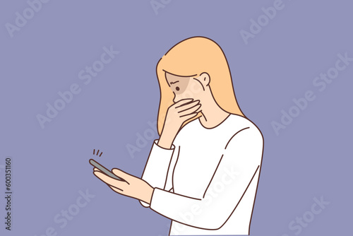 Frightened woman with phone became victim of cyberbullying and received messages with hate speech