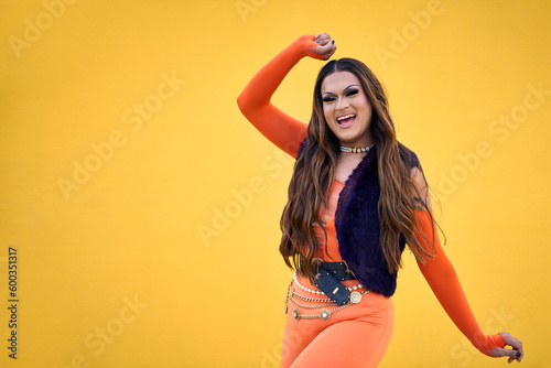 Obraz na płótnie Portrait of excited transgender young with yellow background