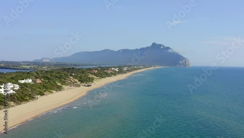 Aerial view of the seafront of Sabaudia, Italy. The beach is almost empty. In the background the Circeo promontory.