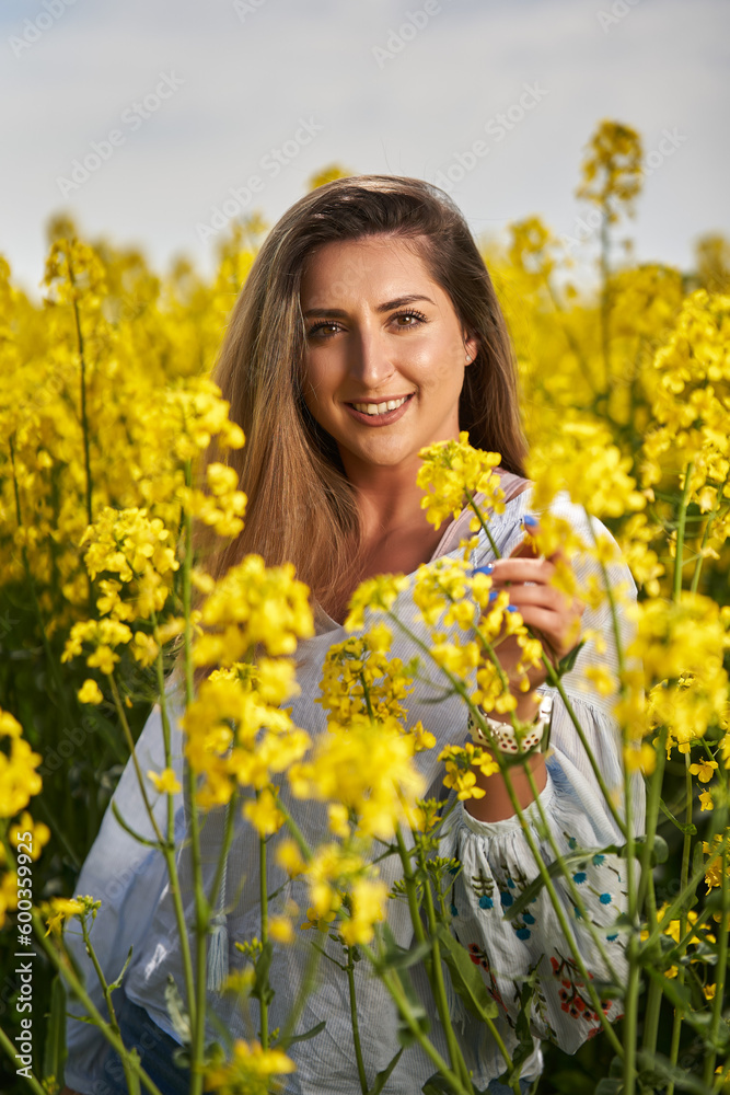 Beautiful blonde latino woman in a canola field Beautiful blonde latino woman in a canola field