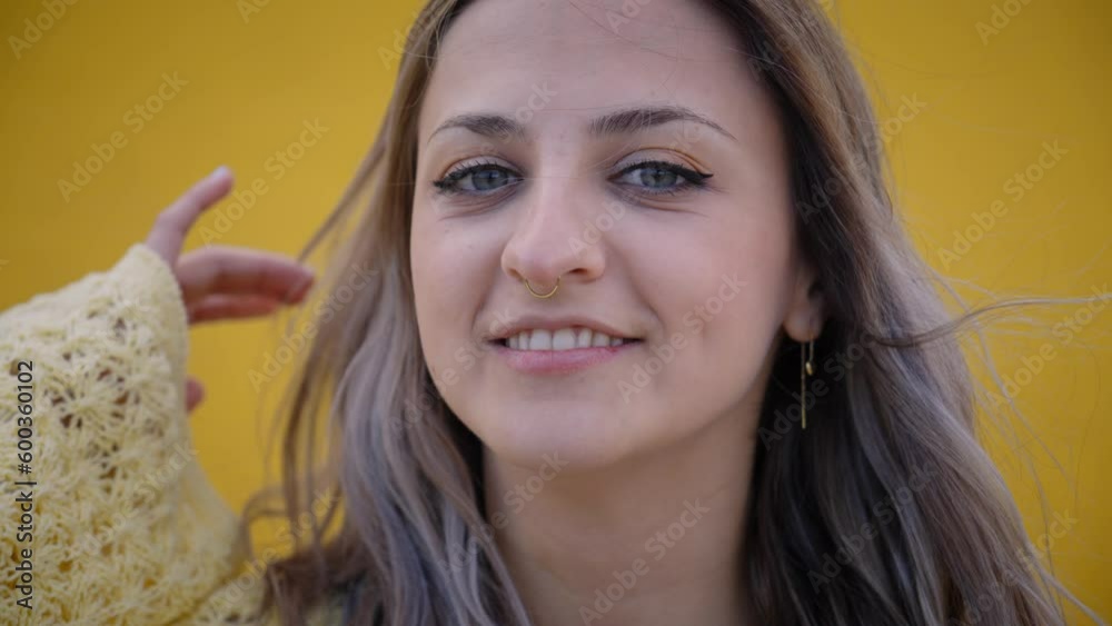 Close up portrait of young blonde girl with beautiful smile looking at ...