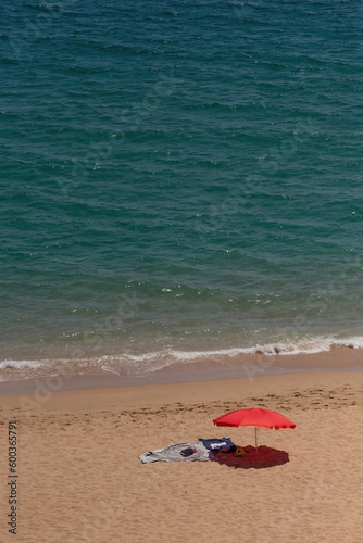 Fototapeta Naklejka Na Ścianę i Meble -  Sandy beach umbrella sea coast sunny day