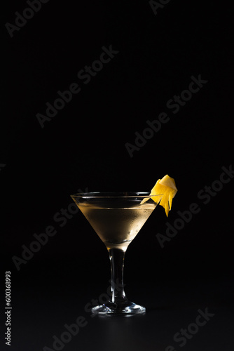 Lillet cocktail with sparkling wine and orange juice on a black background
