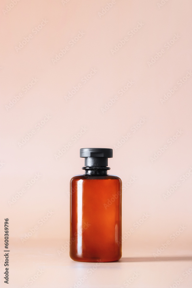 Abstract cosmetic bottle at pink background. Minimalist aesthetic concept Abstract cosmetic bottle at pink background. Minimalist aesthetic concept