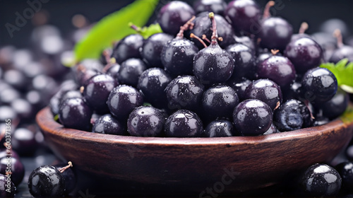 Close up of acai berries in a wooden bowl photo