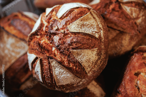 Organic Bakery - details of baker baking bread photo