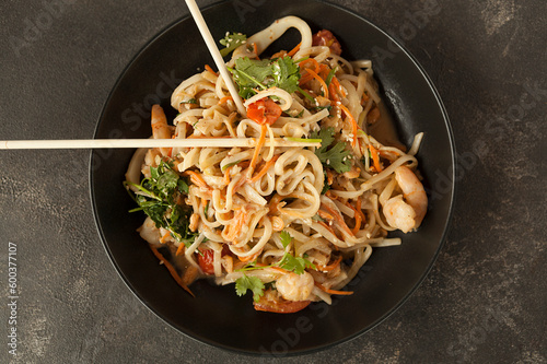 asian noodles with vegetables and shrimp in cream sauce, asian cuisine