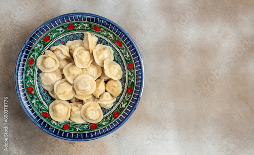 dumpling uzbek cuisine. Uzbek food Manti or dumplings. Homemade Uzbek dish. Long banner format. top view photo