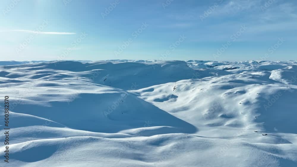 Heavy snowpack on Vikafjell Mountain Norway, good for hydroelectric electricity production - Masts with powerlines passing on ridge in middle of frame Heavy snowpack on Vikafjell Mountain Norway, good for hydroelectric electricity production - Masts with powerlines passing on ridge in middle of frame