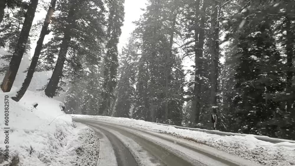 Driving On The Road During Snowfall In Gulmarg Near Kashmir Mountains During Winter In India. POV Driving On The Road During Snowfall In Gulmarg Near Kashmir Mountains During Winter In India. POV