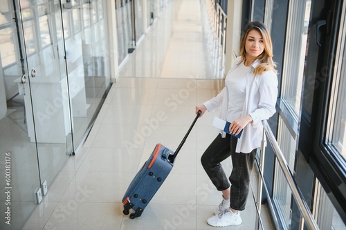 Pretty young female passenger at the airport