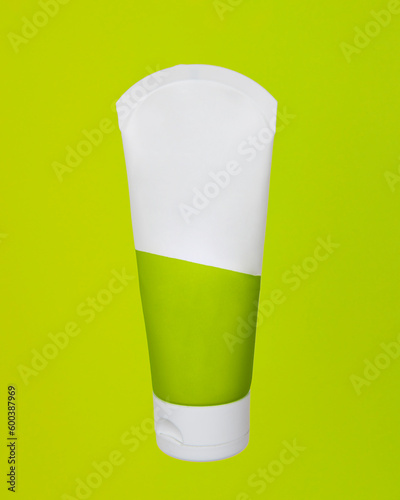 Top view of mockup of white squeeze bottle plastic tube for branding of medicine or cosmetics - cream, gel, skin care, toothpaste. Cosmetic bottle container