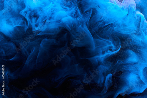 Blue color abstract smoke background. Mix alcohol ink, creative liquid art mock-up with copy space. Acrylic paint waves underwater