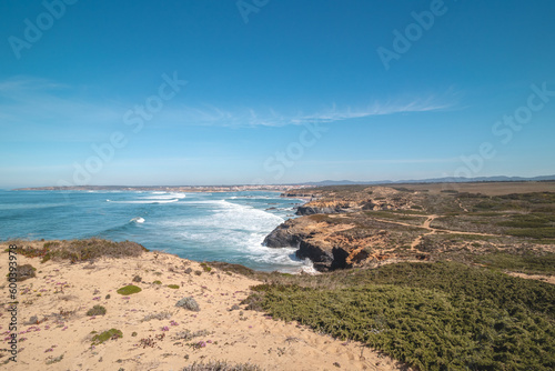 Mountainous and unstable rocky scenery at Atlantic Coast on a sunny day in the Odemira region, western Portugal. Wandering along the Fisherman Trail, Rota Vicentina
