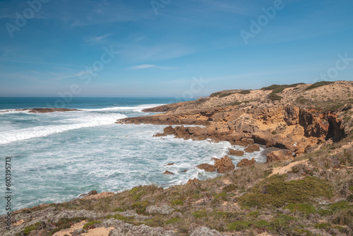 Mountainous and unstable rocky scenery at Atlantic Coast on a sunny day in the Odemira region, western Portugal. Wandering along the Fisherman Trail, Rota Vicentina