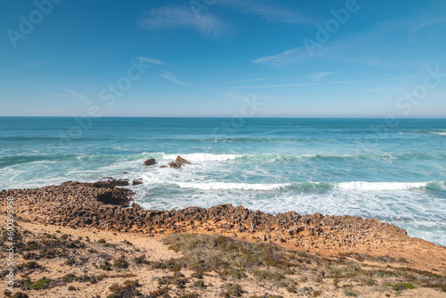 Mountainous and unstable rocky scenery at Atlantic Coast on a sunny day in the Odemira region, western Portugal. Wandering along the Fisherman Trail, Rota Vicentina