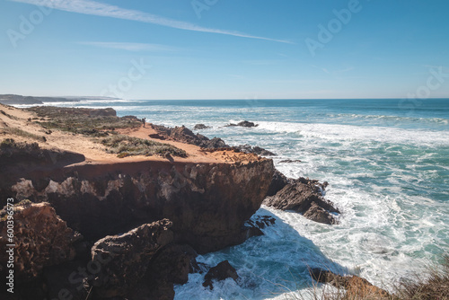 Mountainous and unstable rocky scenery at Atlantic Coast on a sunny day in the Odemira region, western Portugal. Wandering along the Fisherman Trail, Rota Vicentina