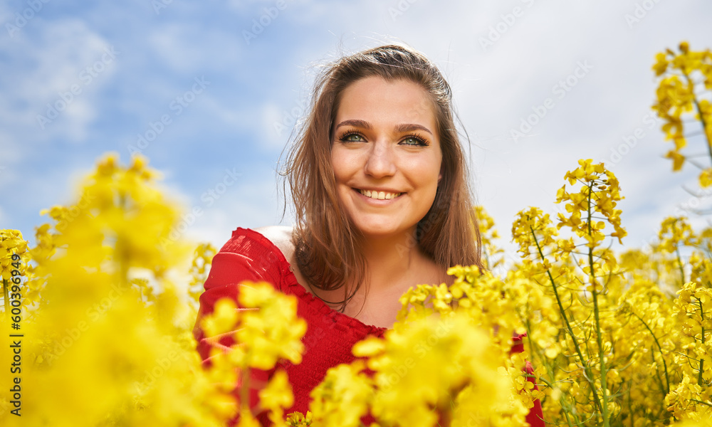Beautiful woman with blue eyes in a canola field Beautiful woman with blue eyes in a canola field