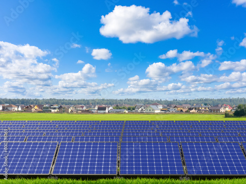 Glade with solar panels. Ba...