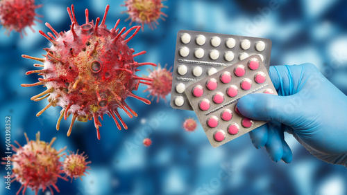 Antiviral medicine. Antibiotics in hand. Blisters with tablets. Medications to fight infection. Bacteria viruses in body. Tablets for treatment of disease. Concept sale and production of antibiotics