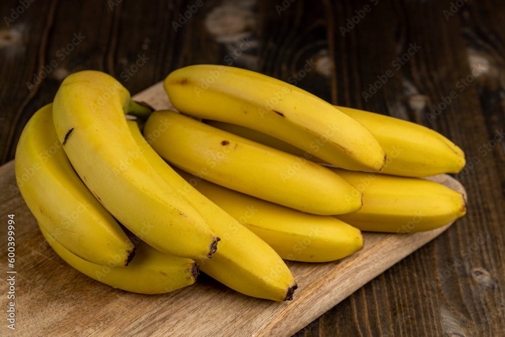 a bunch of bananas lies on the table a bunch of bananas lies on the table