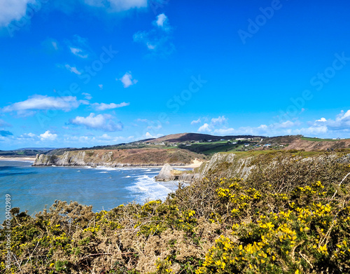 Three Cliffs Bay, a popular tourist destination located on the south coast of the Gower Peninsula in Wales.