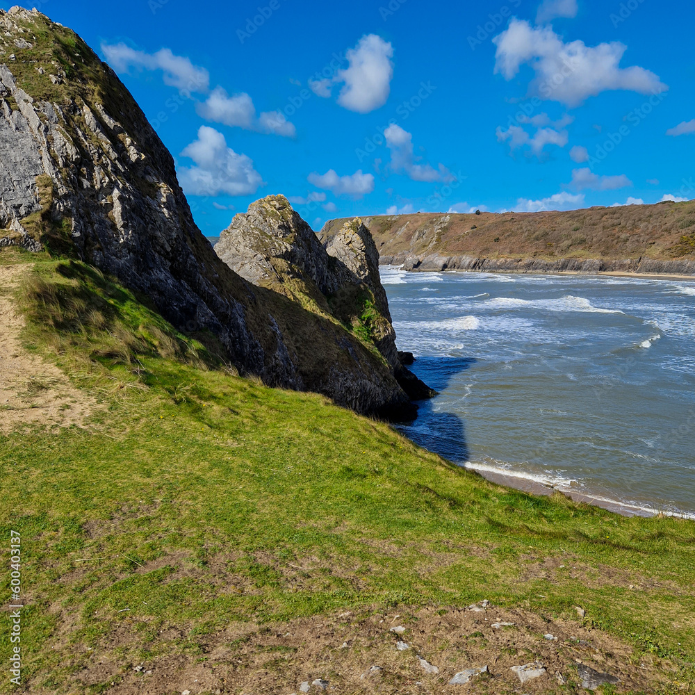 Three Cliffs Bay, a popular tourist destination located on the south coast of the Gower Peninsula in Wales.