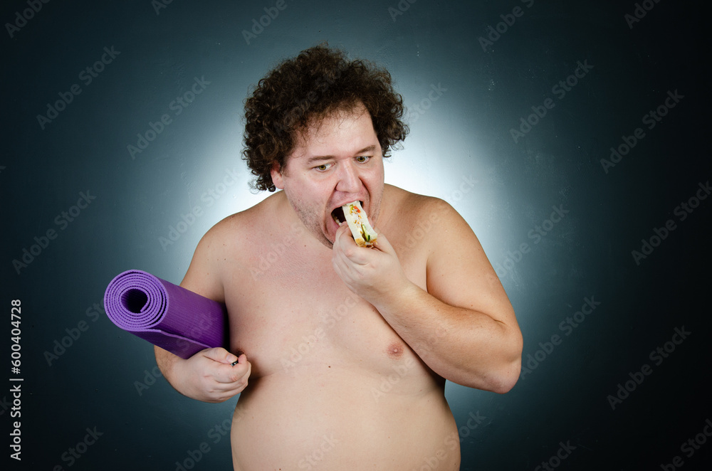 Fototapeta premium Diet, sport and healthy lifestyle. Funny fat and healthy food. 