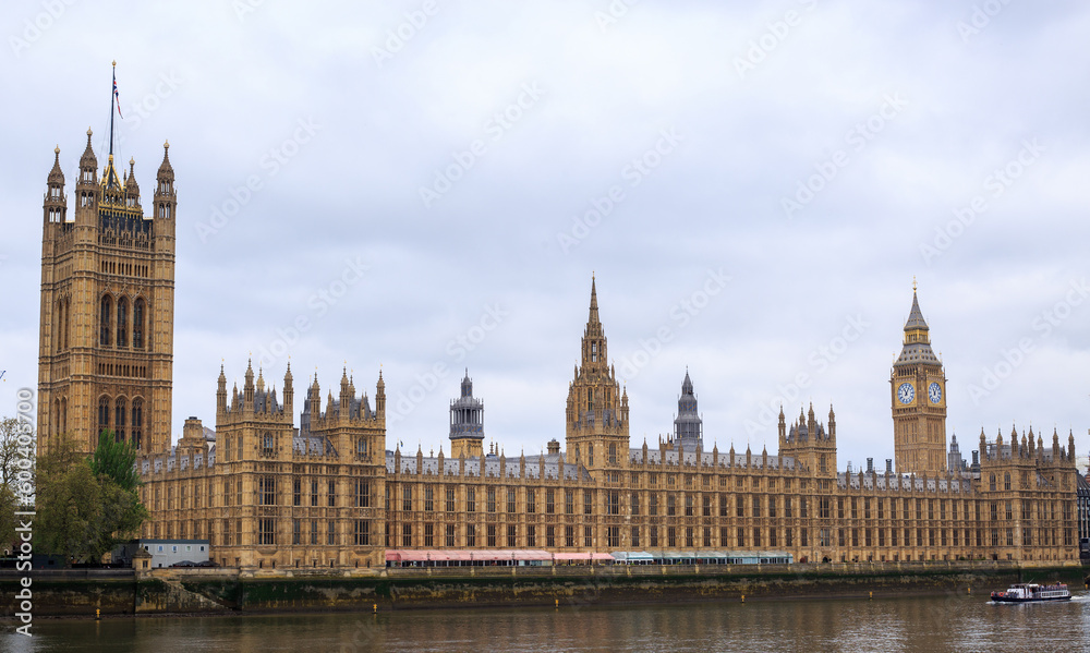 Panoramic view of the Houses of Parliament and the Palace of Westminster located on the River Thames in London.. Panoramic view of the Houses of Parliament and the Palace of Westminster located on the River Thames in London..