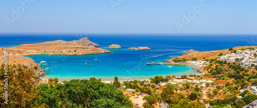 Sea skyview landscape photo Lindos bay and castle on Rhodes island, Dodecanese, Greece. Panorama with ancient castle and clear blue water. Famous tourist destination in South Europe photo