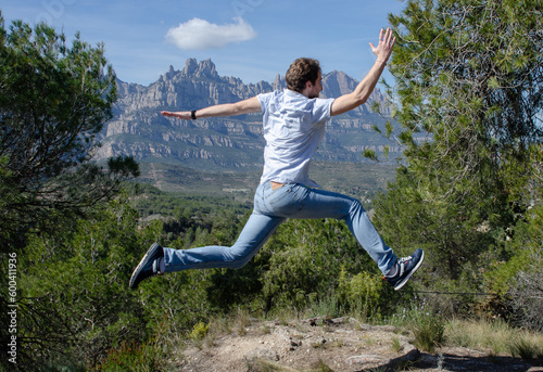 A man jumps with happiness. Concept of achieving goals and motivation.