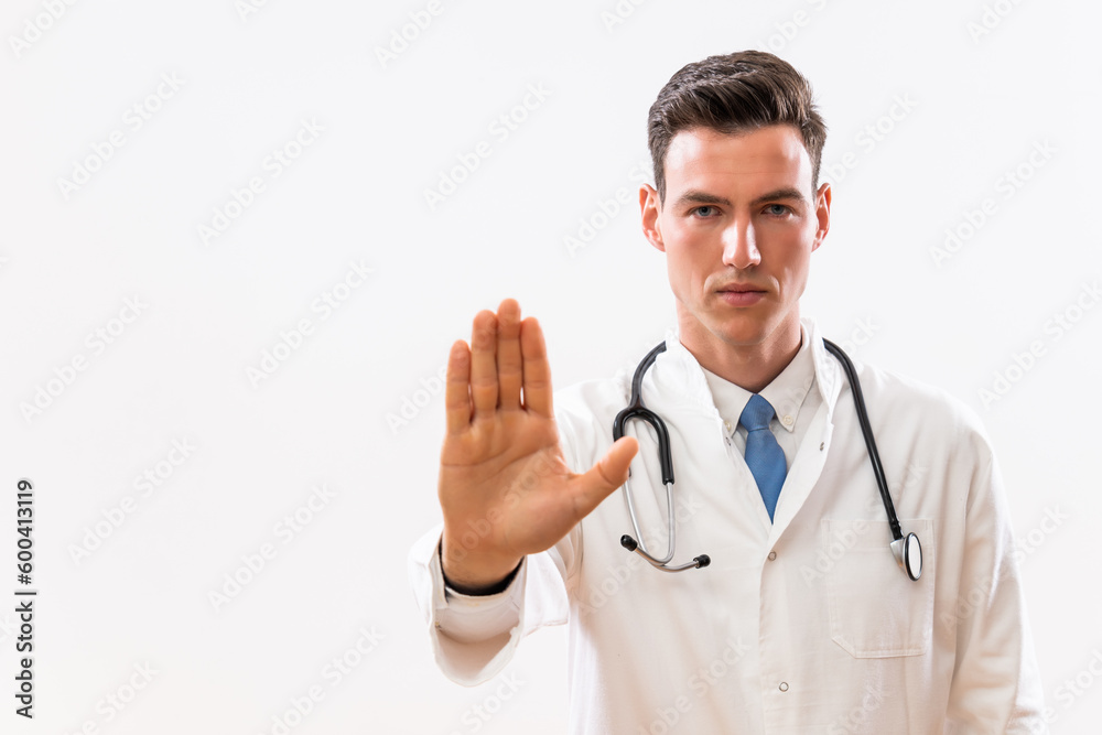 Portrait of young doctor showing stop sign. Portrait of young doctor showing stop sign.