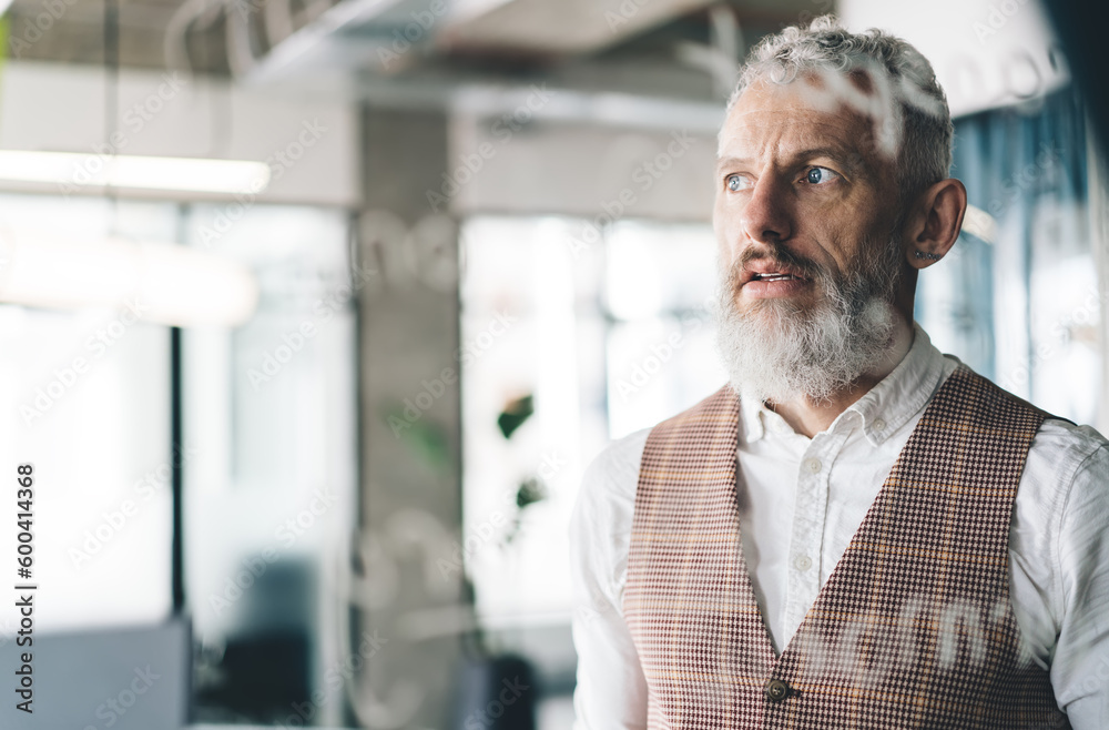 Pensive senior man in modern office Pensive senior man in modern office