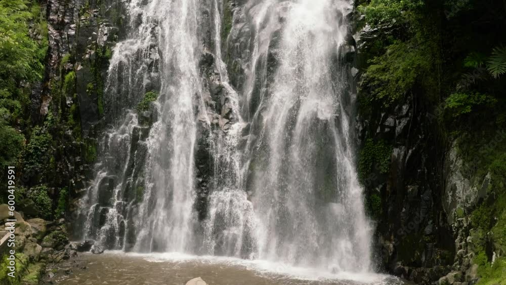 Beautiful waterfall in green forest in slow motion. Efrata Falls in mountain jungle. Sumatra, Indonesia. Beautiful waterfall in green forest in slow motion. Efrata Falls in mountain jungle. Sumatra, Indonesia.