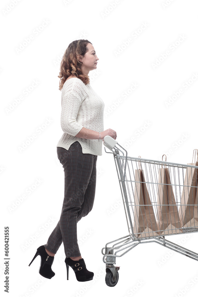 casual young woman with shopping cart. isolated on a white casual young woman with shopping cart. isolated on a white