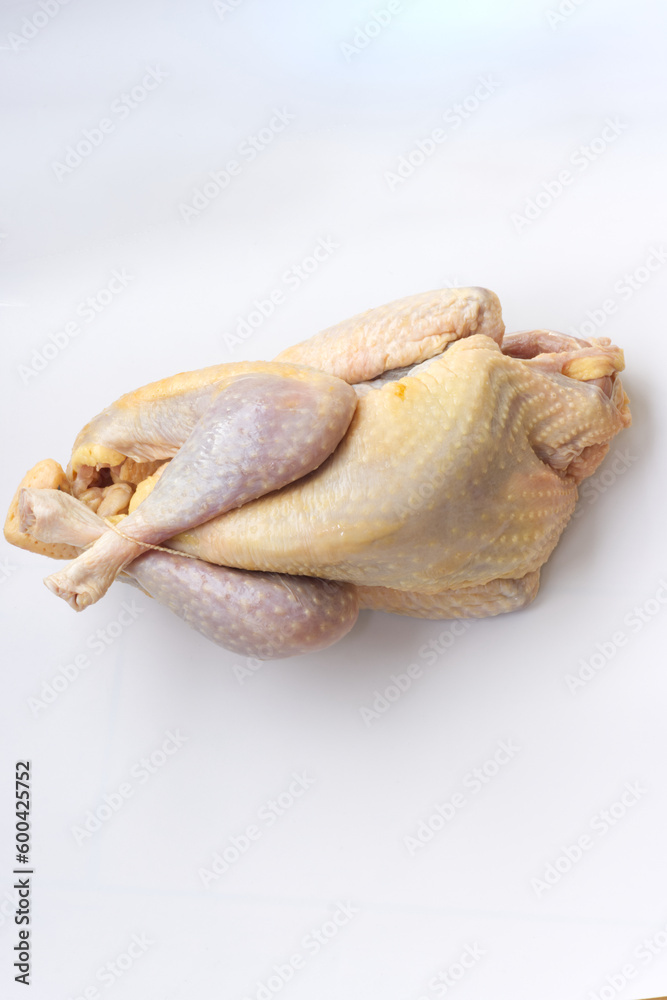 Close up on raw farm guinea fowl ready to cook on white background. Close up on raw farm guinea fowl ready to cook on white background.