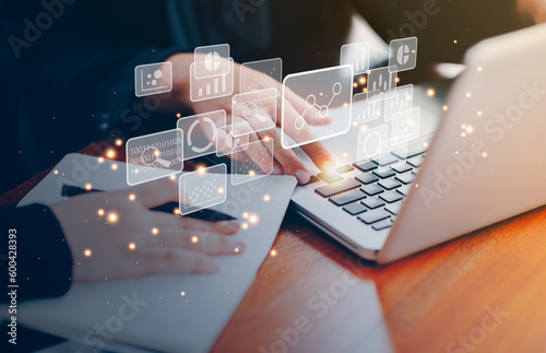 Businessman Big data analytics and business intelligence concept with chart and graph icons on the labtop.