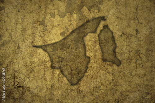 map of brunei on a old vintage crack paper background .
