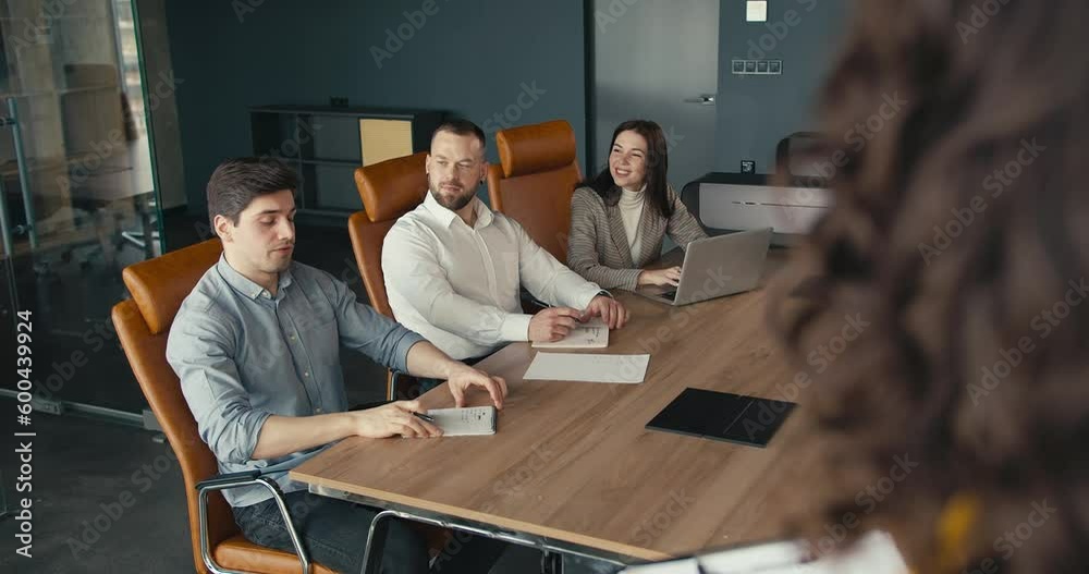 Productive Meeting: Businesswoman Answers Questions from Engaged Team Using Tablet in Contemporary Office Productive Meeting: Businesswoman Answers Questions from Engaged Team Using Tablet in Contemporary Office