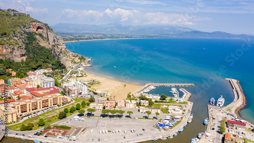 Aerial view of the port of Terracina, near Rome, in the Province of Latina, Italy. There are many boats moored at the marina. In the background are Sant'Angelo mount and the Lazio coast.