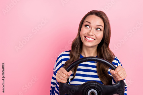 Photo of young beautiful girl wear sailor shirt steering wheel driving porsche car looking empty space isolated on pink color background
