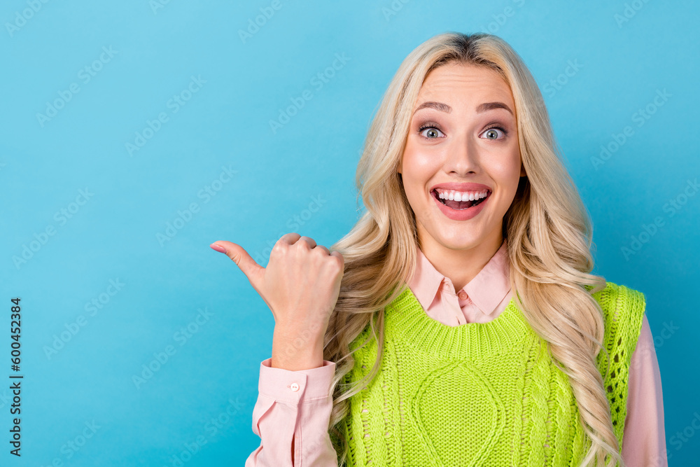 Portrait of funny pretty girl indicate finger sale proposition open mouth wear smart casual clothes isolated blue color background Portrait of funny pretty girl indicate finger sale proposition open mouth wear smart casual clothes isolated blue color background